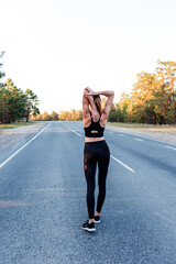 woman with vitiligo warming up before jogging near the road.
Healthy woman warming up before running and relaxing by stretching her arms. runner people workout fitness background.
