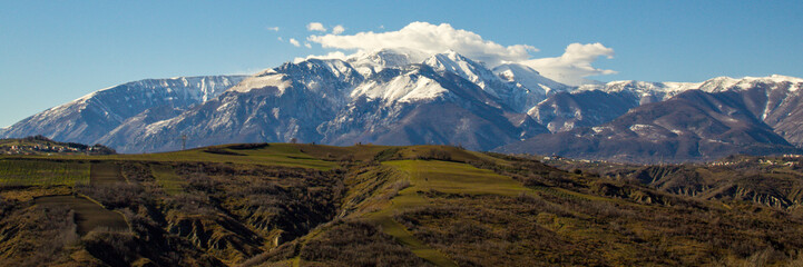 view of the Majella mountain in Abruzzo Italy with snowy peak. Banner.