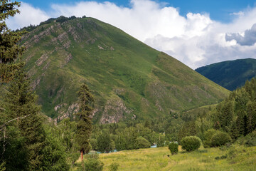 Green mountains landscape in summer season. Nature landscape. Beautiful Koksu river valley.