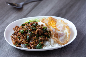 Stir-fried basil with minced pork and fried egg, popular Thai food.