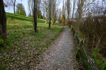 Gravel walking trail in Luther Burbank Park on Mercer Island, WA, winter recreation on a cold sunny day
