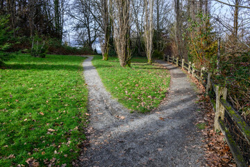 Gravel walking trail in Luther Burbank Park on Mercer Island, WA, winter recreation on a cold sunny day
