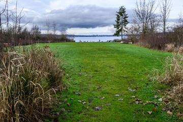 Calkins Point open space in Luther Burbank Park on Mercer Island, WA, winter recreation on a cold sunny day
