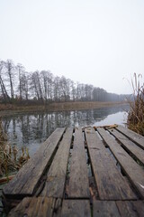 Naklejka premium wooden bridge over lake