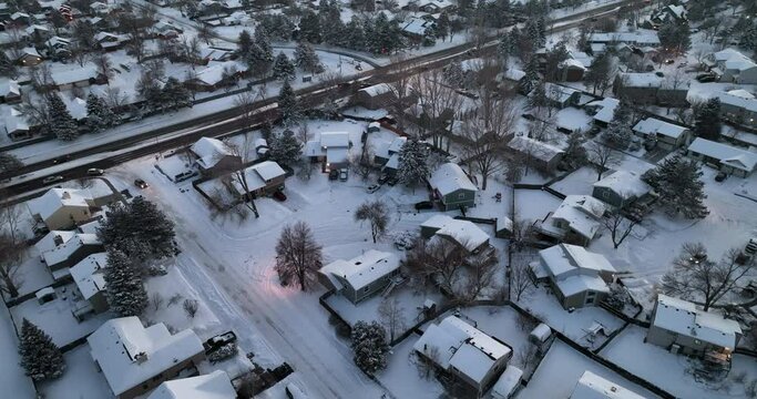 evening traffic in residential area of Fort Collins in northern Colorado, aerial view of winter scenery with fresh snow