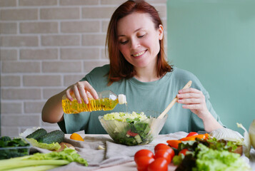 woman preparing salad. Kitchen background. Vegan food, detox. Healthy lifestyle. Raw food. Ready to eat 