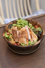Grilled chicken with green salad. Keto diet, healthy eating. Top view on white table with space for text.