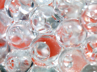 translucent ice balls with red background