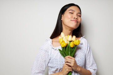 woman romance bouquet of flowers near the face studio model unaltered