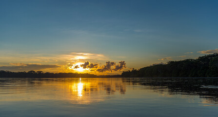 Amazon rainforest sunset panorama along the Pastaza river, Ecuador.