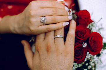 Fototapeta premium The hands of the wearing a ring on the engagement day