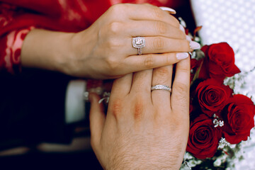 The hands of the wearing a ring on the engagement day