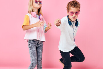 adorable little kids in sunglasses have fun with friends studio posing