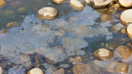 Polluted water with oily surface
