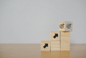 Business goal achievement concept. Wooden cubes block with 