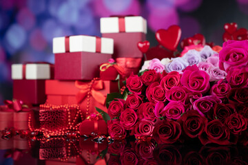Valentines day theme. Gifts in boxes, red hearts and big bouquet of natural roses on blue bokeh background.
