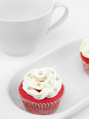 red muffin with white cream