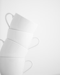 4 stacked cups in white, high key