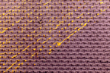 Purple textured background with splashes of yellow paint