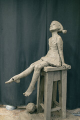 Female clay human woman sculpture. Statue craft creation workshop.