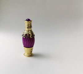 An antique looking Arabian perfume bottle.