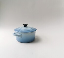 A tiny blue pot. Decorative display.