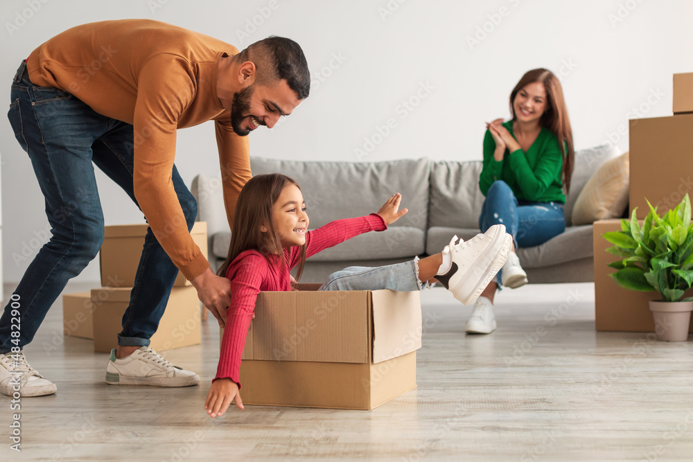 Poster happy arab family playing, celebrating relocation in new house