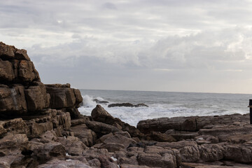 Seascape view with rocks and waves of Uvongu in Margate, the South Coast of South Africa