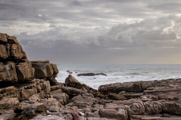 Fototapeta na wymiar Seascape view with rocks and waves of Uvongu in Margate, the South Coast of South Africa