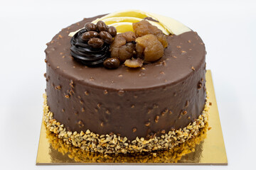 Celebratory cake on a gray background. Cake made with chestnuts and chocolate