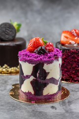 Patisserie cakes. Banana, Chocolate and Fruit Cakes on a black background.