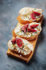 bruschetta with pears, cottage cheese, figs, thyme, nuts and honey. wine snacks