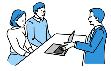 パソコンを見せながら説明している若いスーツの男性と若い男女
