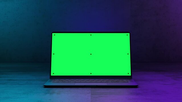 Mockup Shot of a Laptop Computer with Green Screen in Dark Concrete Environemnt