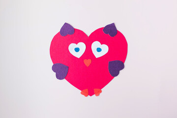 Fototapeta premium The owl-shaped valentine is made of paper. Children's crafts.
