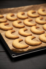 Baking tray with traditional German or Austrian Vanillekipferl vanilla kipferl cookies