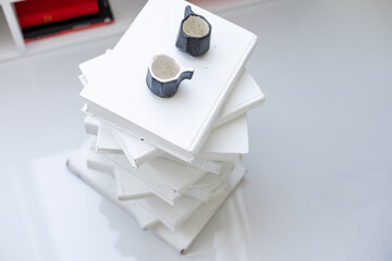 stack of books and the stand of books on white background