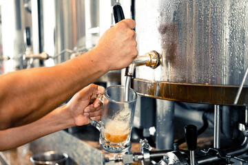 Fototapeta na wymiar Bartender pouring beer