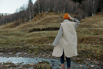 woman in the autumn forest walk fresh air travel relaxation