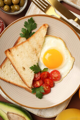 Fototapeta na wymiar Tasty breakfast composition on brown background, top view