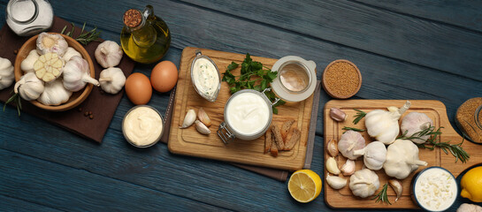 Concept of cooking garlic sauce on wooden background