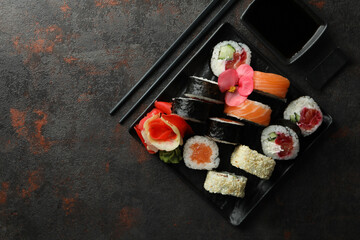 Concept of tasty food with sushi rolls, space for text