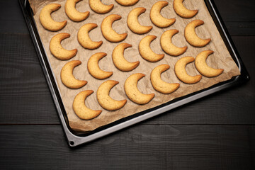 Baking tray with traditional German or Austrian Vanillekipferl vanilla kipferl cookies