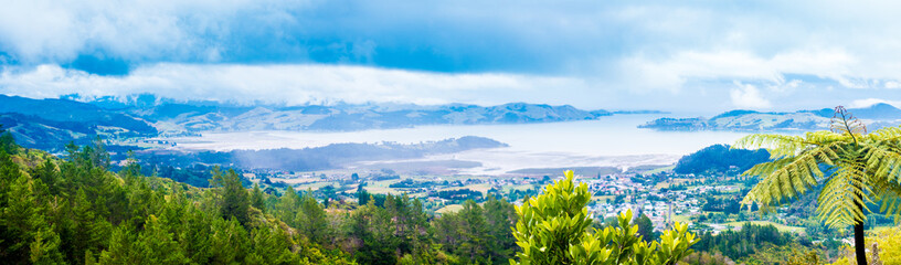 Fototapeta na wymiar New Zealand jungle panorama hills and bay On the horizon
