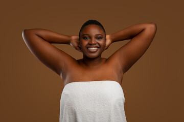 Portrait of beautiful plus size African american woman showing armpits