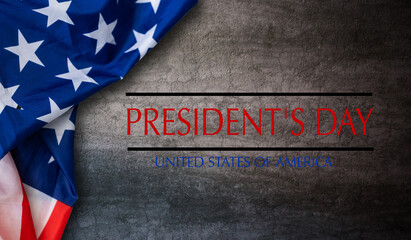 Fototapeta na wymiar Happy presidents day concept with vintage flag of the United States on old stone background