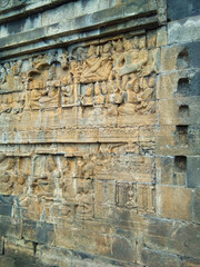Ancient carved wall at Borobudur Temple. Borobudur Temple is an ancient Buddhist temple which is located in Magelang, Central Java, Indonesia.