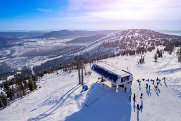 Sheregesh ski lift resort winter, landscape mountain and hotels, aerial top view Russia Kemerovo...