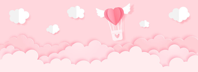 Balloon in the sky heart in above the clouds on a pink background, paper cut style, valentine's day