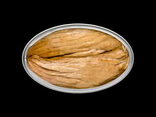 Top view of a tin can with tuna inside on a black background so that it can be silhouetted and the...
